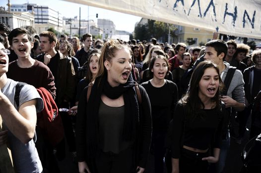 GREECE, Athens: Thousands of student-protesters fill the streets of Athens, Greece on November 2, 2015. The young demonstrators yell chants and carry signs as they rally against cuts to education and a shortage of teachers, amid ongoing protests against austerity in Greece. Reports from local media indicate that a contingent had broken off from the larger protest, vandalizing a cell phone store, and trying to damage a bank on Othonos, a street in Athens.