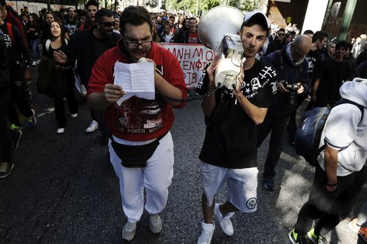 GREECE, Athens: Thousands of student-protesters fill the streets of Athens, Greece on November 2, 2015. The young demonstrators yell chants and carry signs as they rally against cuts to education and a shortage of teachers, amid ongoing protests against austerity in Greece. Reports from local media indicate that a contingent had broken off from the larger protest, vandalizing a cell phone store, and trying to damage a bank on Othonos, a street in Athens.