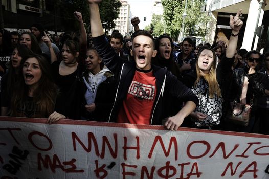 GREECE, Athens: Thousands of student-protesters fill the streets of Athens, Greece on November 2, 2015. The young demonstrators yell chants and carry signs as they rally against cuts to education and a shortage of teachers, amid ongoing protests against austerity in Greece. Reports from local media indicate that a contingent had broken off from the larger protest, vandalizing a cell phone store, and trying to damage a bank on Othonos, a street in Athens.