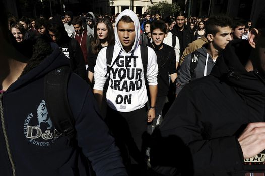 GREECE, Athens: Thousands of student-protesters fill the streets of Athens, Greece on November 2, 2015. The young demonstrators yell chants and carry signs as they rally against cuts to education and a shortage of teachers, amid ongoing protests against austerity in Greece. Reports from local media indicate that a contingent had broken off from the larger protest, vandalizing a cell phone store, and trying to damage a bank on Othonos, a street in Athens.