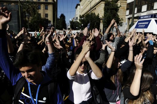 GREECE, Athens: Thousands of student-protesters fill the streets of Athens, Greece on November 2, 2015. The young demonstrators yell chants and carry signs as they rally against cuts to education and a shortage of teachers, amid ongoing protests against austerity in Greece. Reports from local media indicate that a contingent had broken off from the larger protest, vandalizing a cell phone store, and trying to damage a bank on Othonos, a street in Athens.