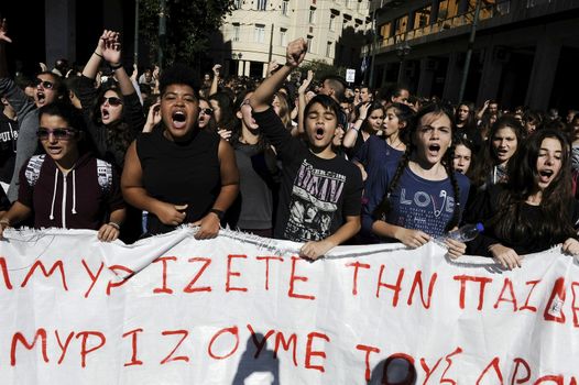 GREECE, Athens: Thousands of student-protesters fill the streets of Athens, Greece on November 2, 2015. The young demonstrators yell chants and carry signs as they rally against cuts to education and a shortage of teachers, amid ongoing protests against austerity in Greece. Reports from local media indicate that a contingent had broken off from the larger protest, vandalizing a cell phone store, and trying to damage a bank on Othonos, a street in Athens.