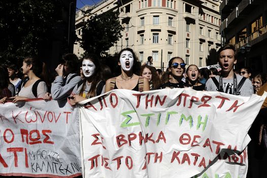 GREECE, Athens: Thousands of student-protesters fill the streets of Athens, Greece on November 2, 2015. The young demonstrators yell chants and carry signs as they rally against cuts to education and a shortage of teachers, amid ongoing protests against austerity in Greece. Reports from local media indicate that a contingent had broken off from the larger protest, vandalizing a cell phone store, and trying to damage a bank on Othonos, a street in Athens.