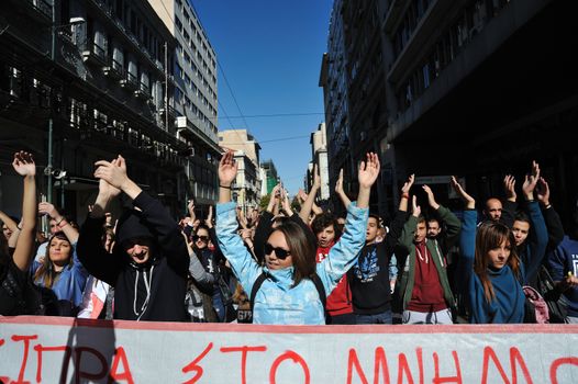 GREECE, Athens: Thousands of student-protesters fill the streets of Athens, Greece on November 2, 2015. The young demonstrators yell chants and carry signs as they rally against cuts to education and a shortage of teachers, amid ongoing protests against austerity in Greece. Reports from local media indicate that a contingent had broken off from the larger protest, vandalizing a cell phone store, and trying to damage a bank on Othonos, a street in Athens.