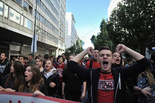 GREECE, Athens: Thousands of student-protesters fill the streets of Athens, Greece on November 2, 2015. The young demonstrators yell chants and carry signs as they rally against cuts to education and a shortage of teachers, amid ongoing protests against austerity in Greece. Reports from local media indicate that a contingent had broken off from the larger protest, vandalizing a cell phone store, and trying to damage a bank on Othonos, a street in Athens.