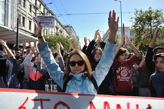 GREECE, Athens: Thousands of student-protesters fill the streets of Athens, Greece on November 2, 2015. The young demonstrators yell chants and carry signs as they rally against cuts to education and a shortage of teachers, amid ongoing protests against austerity in Greece. Reports from local media indicate that a contingent had broken off from the larger protest, vandalizing a cell phone store, and trying to damage a bank on Othonos, a street in Athens.