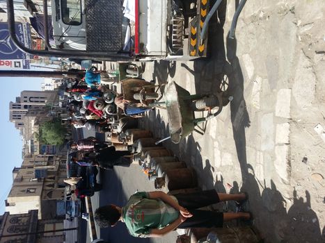 YEMEN, Sanaa :  Yemenis wait to exchange their empty gas cylinders at al-Safya street in Sanaa on November 1, 2015. People have to wait for hours at exchange stations in the impoverished country which is suffering from a gas shortage. Because of the ongoing clashes, there is gas and food shortage in Yemen which is under the Houthi blockade.	 