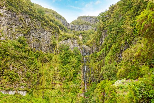 View of 25 fontes falls (25 fountains waterfalls) and greenish forest landscape on Madeira, the hiking and flower island