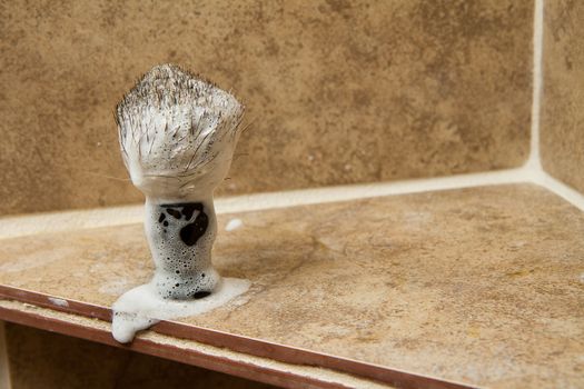 soaped up shaving brush ready to lather someones face
