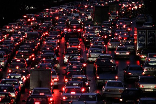 IRAN, Tehran: A massive traffic jam sees cars lined up bumper-to-bumper as rain falls in Tehran, Iran in the evening of November 2, 2015.