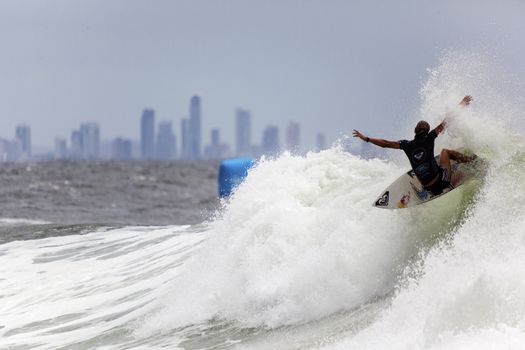 SNAPPER ROCKS, GOLD COAST, AUSTRALIA - 9 MARCH: Unidentified Surfer races the Quiksilver & Roxy Pro World Title Event. 9 March 2013, Snapper Rocks, Gold Coast, Australia