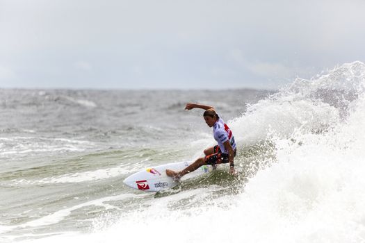 SNAPPER ROCKS, GOLD COAST, AUSTRALIA - 9 MARCH: Unidentified Surfer races the Quiksilver & Roxy Pro World Title Event. 9 March 2013, Snapper Rocks, Gold Coast, Australia