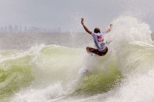 SNAPPER ROCKS, GOLD COAST, AUSTRALIA - 9 MARCH: Unidentified Surfer races the Quiksilver & Roxy Pro World Title Event. 9 March 2013, Snapper Rocks, Gold Coast, Australia