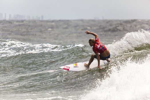 SNAPPER ROCKS, GOLD COAST, AUSTRALIA - 9 MARCH: Unidentified Surfer races the Quiksilver & Roxy Pro World Title Event. 9 March 2013, Snapper Rocks, Gold Coast, Australia