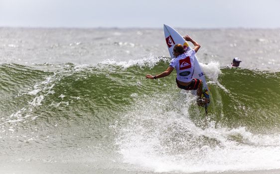 SNAPPER ROCKS, GOLD COAST, AUSTRALIA - 9 MARCH: Unidentified Surfer races the Quiksilver & Roxy Pro World Title Event. 9 March 2013, Snapper Rocks, Gold Coast, Australia