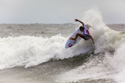 SNAPPER ROCKS, GOLD COAST, AUSTRALIA - 9 MARCH: Unidentified Surfer races the Quiksilver & Roxy Pro World Title Event. 9 March 2013, Snapper Rocks, Gold Coast, Australia