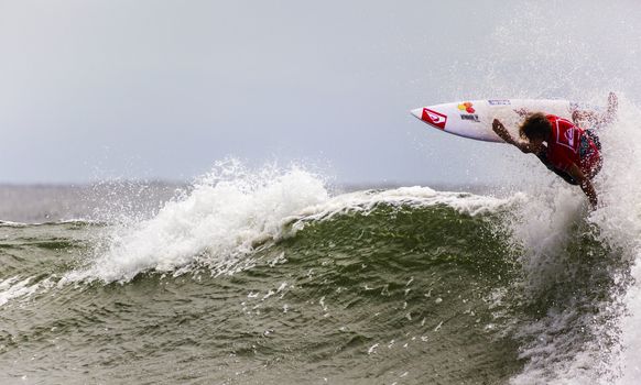 SNAPPER ROCKS, GOLD COAST, AUSTRALIA - 9 MARCH: Unidentified Surfer races the Quiksilver & Roxy Pro World Title Event. 9 March 2013, Snapper Rocks, Gold Coast, Australia