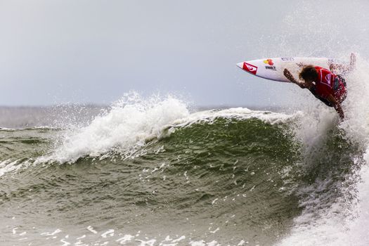 SNAPPER ROCKS, GOLD COAST, AUSTRALIA - 9 MARCH: Unidentified Surfer races the Quiksilver & Roxy Pro World Title Event. 9 March 2013, Snapper Rocks, Gold Coast, Australia