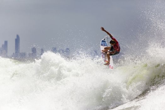 SNAPPER ROCKS, GOLD COAST, AUSTRALIA - 9 MARCH: Unidentified Surfer races the Quiksilver & Roxy Pro World Title Event. 9 March 2013, Snapper Rocks, Gold Coast, Australia