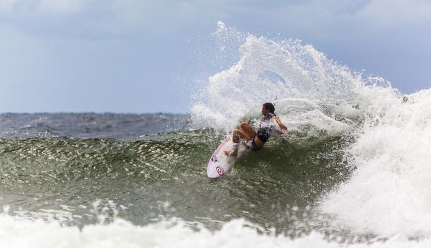 SNAPPER ROCKS, GOLD COAST, AUSTRALIA - 9 MARCH: Unidentified Surfer races the Quiksilver & Roxy Pro World Title Event. 9 March 2013, Snapper Rocks, Gold Coast, Australia