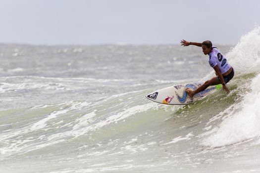 SNAPPER ROCKS, GOLD COAST, AUSTRALIA - 9 MARCH: Unidentified Surfer races the Quiksilver & Roxy Pro World Title Event. 9 March 2013, Snapper Rocks, Gold Coast, Australia