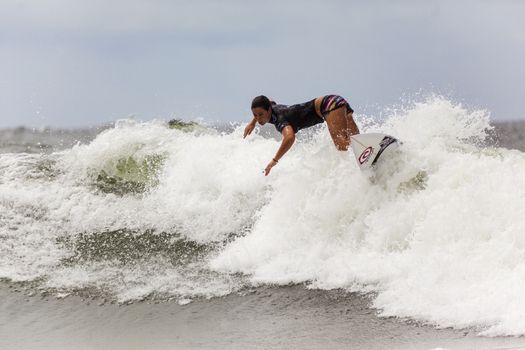 SNAPPER ROCKS, GOLD COAST, AUSTRALIA - 9 MARCH: Unidentified Surfer races the Quiksilver & Roxy Pro World Title Event. 9 March 2013, Snapper Rocks, Gold Coast, Australia