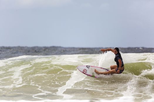 SNAPPER ROCKS, GOLD COAST, AUSTRALIA - 9 MARCH: Unidentified Surfer races the Quiksilver & Roxy Pro World Title Event. 9 March 2013, Snapper Rocks, Gold Coast, Australia