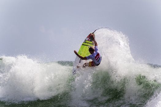 SNAPPER ROCKS, GOLD COAST, AUSTRALIA - 9 MARCH: Unidentified Surfer races the Quiksilver & Roxy Pro World Title Event. 9 March 2013, Snapper Rocks, Gold Coast, Australia