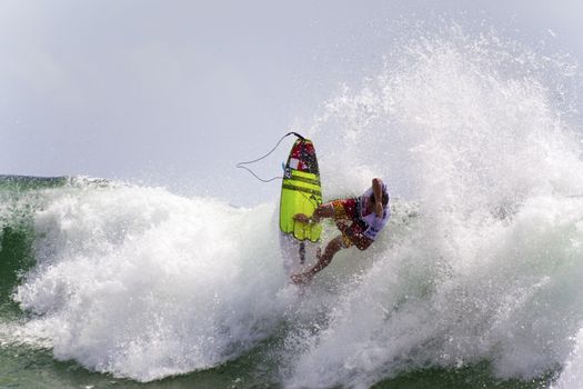 SNAPPER ROCKS, GOLD COAST, AUSTRALIA - 9 MARCH: Unidentified Surfer races the Quiksilver & Roxy Pro World Title Event. 9 March 2013, Snapper Rocks, Gold Coast, Australia