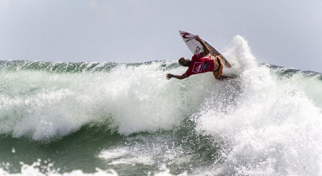 SNAPPER ROCKS, GOLD COAST, AUSTRALIA - 9 MARCH: Unidentified Surfer races the Quiksilver & Roxy Pro World Title Event. 9 March 2013, Snapper Rocks, Gold Coast, Australia