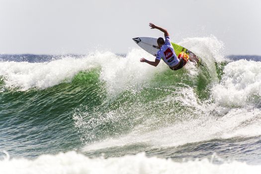 SNAPPER ROCKS, GOLD COAST, AUSTRALIA - 9 MARCH: Unidentified Surfer races the Quiksilver & Roxy Pro World Title Event. 9 March 2013, Snapper Rocks, Gold Coast, Australia