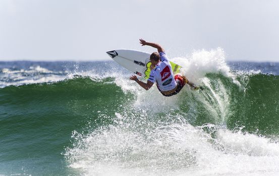 SNAPPER ROCKS, GOLD COAST, AUSTRALIA - 9 MARCH: Unidentified Surfer races the Quiksilver & Roxy Pro World Title Event. 9 March 2013, Snapper Rocks, Gold Coast, Australia