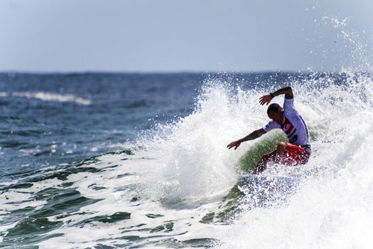 SNAPPER ROCKS, GOLD COAST, AUSTRALIA - 9 MARCH: Unidentified Surfer races the Quiksilver & Roxy Pro World Title Event. 9 March 2013, Snapper Rocks, Gold Coast, Australia