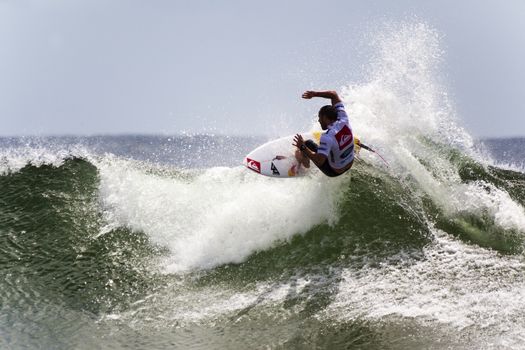 SNAPPER ROCKS, GOLD COAST, AUSTRALIA - 9 MARCH: Unidentified Surfer races the Quiksilver & Roxy Pro World Title Event. 9 March 2013, Snapper Rocks, Gold Coast, Australia