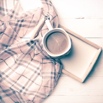 coffee and scarf background on white table vintage style