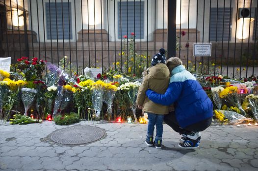 UKRAINE, Kiev: A woman and her child are pictured outside the Russian embassy in Kiev, Ukraine, to pay tribute to the victims of crashed Russian Metrojet plane in Egypt, on November 1, 2015. The Airbus, with 224 people on board, crashed in a mountainous part of Egypt's Sinai Peninsula on October 31, 2015