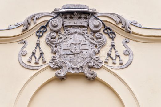 Ancient coat of arms on a house wall. Eger, Hungary