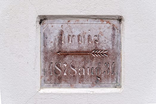 Sign on the wall warning about the level of floods in 1878. Eger, Hungary