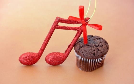 picture of a chocolate muffin on wood background