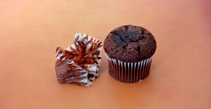 picture of a chocolate muffin on wood background