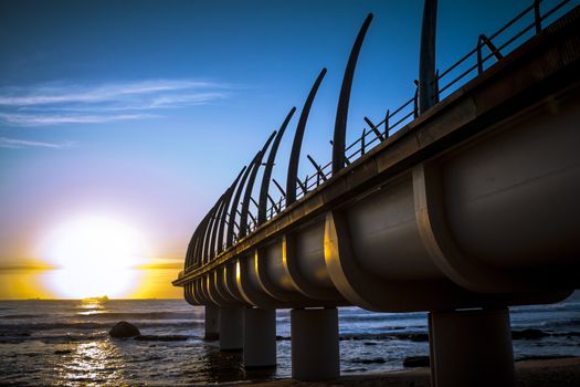 Umhlanga Pier in durban on a clear morning in the sunrise over the Indian ocean