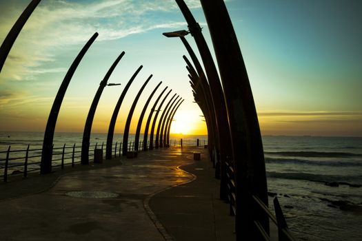 The Umhlanga Pier In Durban South Africa in the Sunrise over horizon of Indian Ocean