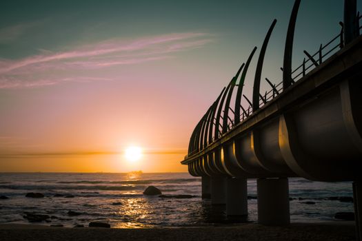 Durban Pier in Umhlanga South Africa in the sunrise over horizon of indian ocean