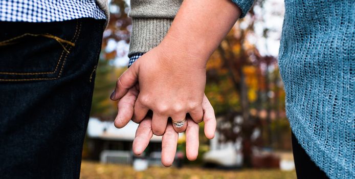 The hands of A young couple contemplating their lives together.