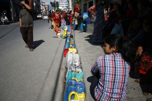 NEPAL, Kathmandu : People wait as they place their empty containers in line to buy kerosene during the ongoing fuel crises that has been continuing for over a month now in Kalikasthan, Kathmandu Kathmandu on November, 3 2015. Amid the dispute over new controversial constitution of Nepal, fuel exports from India have halted, creating an escalating emergency situation.    