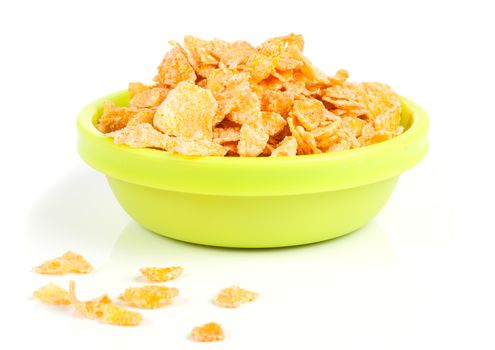 Cornflakes in porcelain bowl isolated on white background