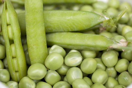 Freshly picked  green peas in open pods