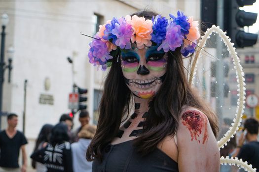 Sao Paulo, Brazil November 11 2015: An unidentified girl in traditional skull costumes in the annual event Zombie Walk in Sao Paulo Brazil.