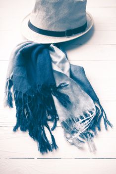 hat and blue scarf on white table vintage style