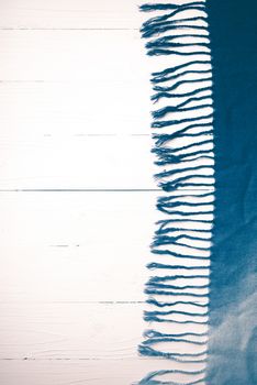 blue scarf over white wood table background vintage style